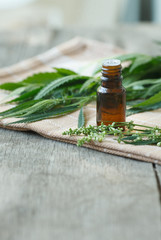 cannabis essential oil container with cannabis leaves 