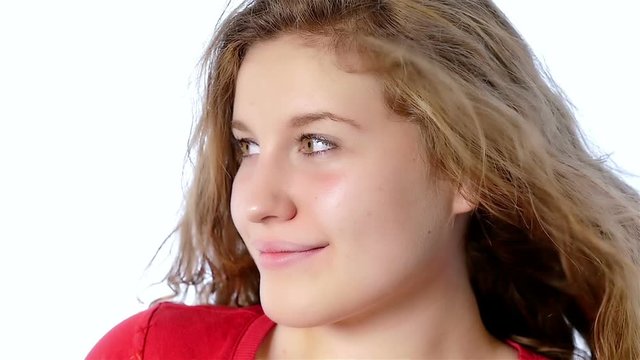 Portrait of a beautiful teenager girl on a white background, slow motion