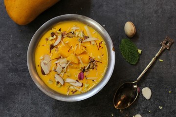 Mango Phirni - Indian  Mango dessert, selective focus