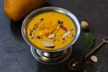 Mango Phirni - Indian  Mango dessert, selective focus