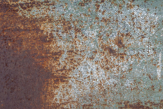 surface of rusty iron with remnants of old paint, grunge metal surface, great background or texture for your project