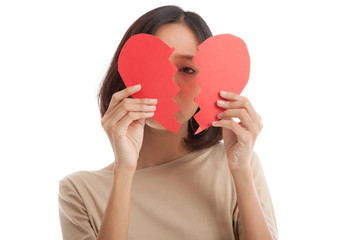 Beautiful young Asian woman with broken heart  isolated on white background