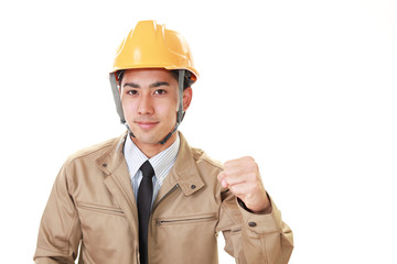 ガッツポーズの労働者