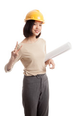 Asian engineer woman with blueprints show victory sign  isolated on white background