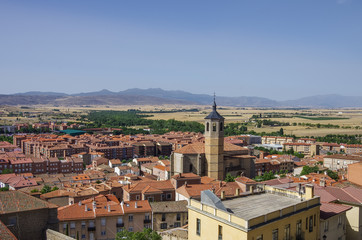 Fototapeta na wymiar Cityscape with rooftop and Church of Santiago in the medieval old town of Avila, Spain