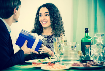 Fototapeta premium Man giving present to woman