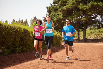 Three friends running a fun race