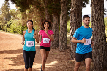 Three cross country marathon race runners