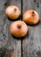 Onions on a wooden background