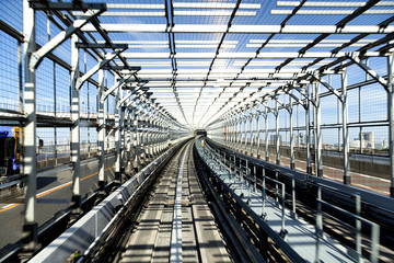 rail track and cityscape of tokyo on view from speed train 
