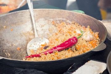 Hot pilau in cauldron.