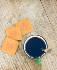 metall cup of tea with cockies