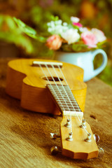 Ukulele  over old wood in vintage style,Selective focus