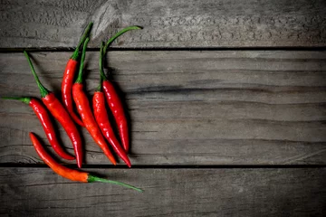 Photo sur Plexiglas Piments forts Top view of red chilli pepper on wooden background