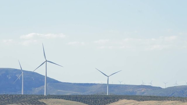 Landscape of wind turbines energy tower moving