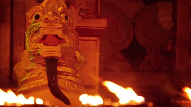 Video 1080p - Grim monster statue a illuminated with lamps lights. Burma, Yangon
