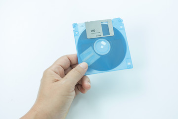 floppy disk in hands on the white background