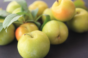 Fresh, ripe summer fruits with leaves 