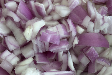This is a closeup photograph of chopped red onions