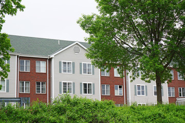 apartment building with spring trees landscape