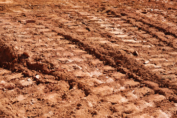 tire track on dirt in construction area