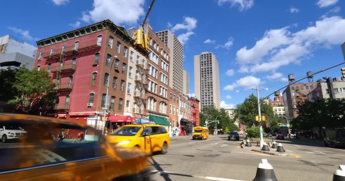 NEW YORK - Circa July, 2016 - A daytime establishing shot of a typical intersection in Chelsea.  	