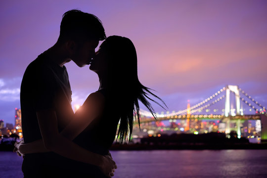 silhouette romantic lovers with Odaiba