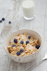 close up view of oatmeal porridge with strawberry on color back