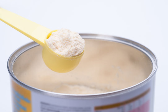 Baby Milk Powder In Cans That Open With A Spoon.