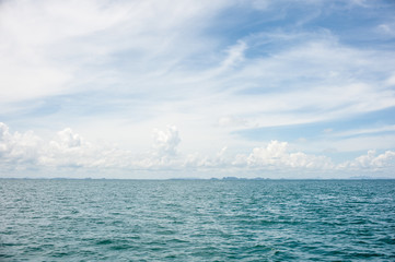 The sun higher than rain cloud over the sea. Krabi, Thailand.