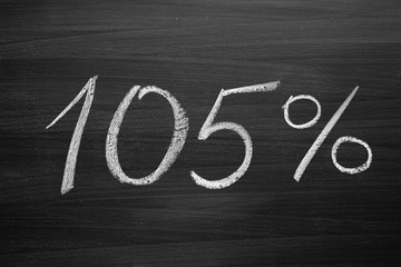 105 percent header written with a chalk on the blackboard