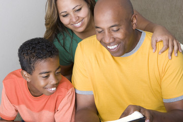 African American Family reading toghter