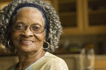 Senior African American woman at home - Powered by Adobe