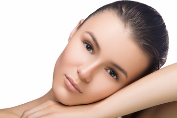 Beautiful woman face close up portrait studio on white. head on hand, looking at camera, spa, fresh clean skin