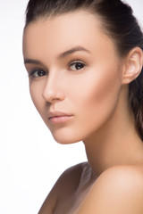 Fototapeta premium Beauty Girl. Beautiful Young Woman with Fresh Clean Skin, Beautiful Face. Pure Natural Beauty. Perfect Skin. Isolated on a White Background. Portrait of Beauty Girl