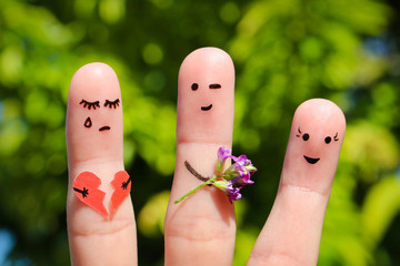 Finger art of family. Man gives bouquet of flowers to another woman. Concept of cheating in relationship. 