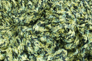 This is a photograph of Green knitting yarn background