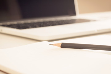 Close-up of comfortable working place with laptop, vintage effec