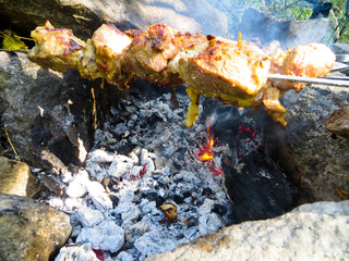 Preparing meat shish kebab (shashlik) on skewers