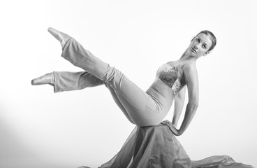sports girl in a ballet hall in  complex  poze.balerina warming up, light tones picture. daylight falls on the blonde  © georg01