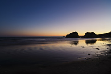 beach at night with blue sky at the south of portugal