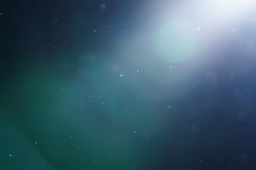 real optical lens flare with some dust floating in the air