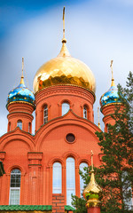 Fototapeta na wymiar bright domes of the Orthodox Church against the clear blue sky