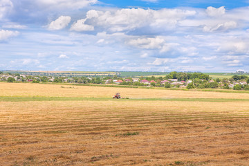 Obraz premium tractor working on field