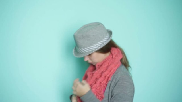 beautiful woman in the hat wears a scarf