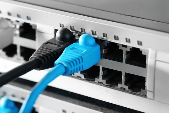 Ethernet cables connected to network switch, close up