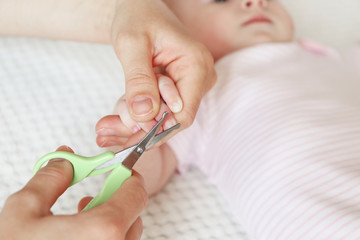 Cutting baby nails, closeup