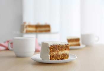 Tasty slice of carrot cake on white plate