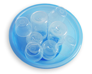 Baby bottles in plastic blue basin