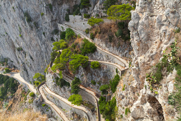 Old empty winding mountain road on Capri